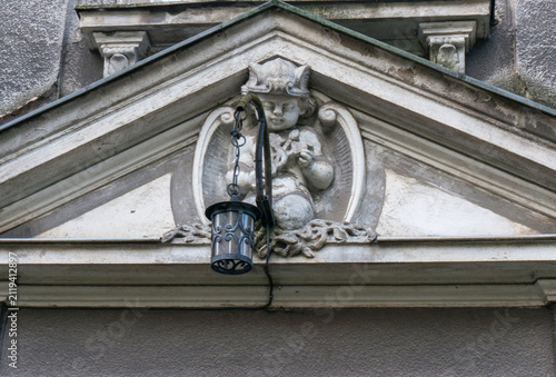 Decorative lantern outdoor, angel, architectural detail. Malbork, Poland.