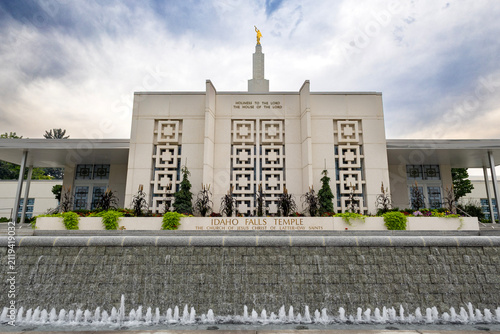 Beautiful exterior view of the Idaho Falls Idaho Temple of The Church of Jesus Christ of Latter-day Saints, featuring its distinctive white spire, elegant architecture, and peaceful grounds 