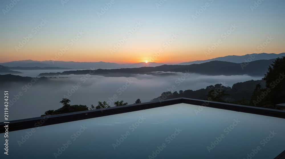 Fototapeta premium Infinity pool rooftop spa overlooking misty mountain sunrise, serene luxury relaxation
