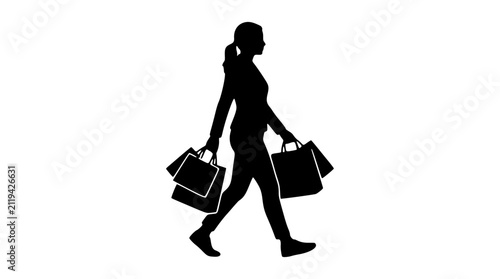 Foto Woman walking with shopping bags silhouette