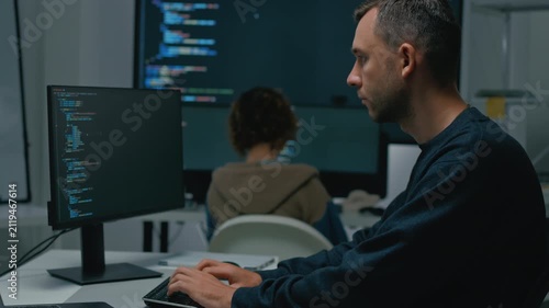 software developer talk strategy plan to executive write prompt AI bot IT app program data analytics in tech startup office.Projected visuals and glowing code on screen.AI chatbot technology concept