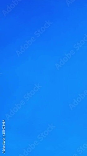 Clear Blue Sky with Soft Wispy Clouds Background
