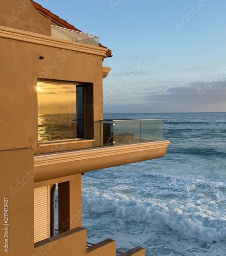 фотографія Luxury oceanfront beach house with modern coastal architecture overlooking the s
