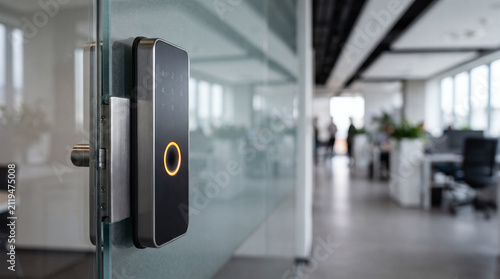 Smart fingerprint door lock installed on a glass office partition