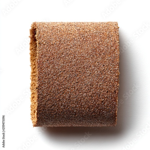 A curved sheet of coarse brown abrasive sandpaper isolated on a white background, viewed from directly above.