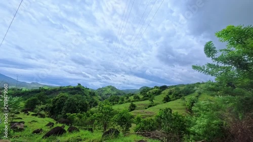 Timelapse of moving clouds above lush tropical hills in Flores, Indonesia