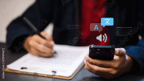 Konstfotografi Person Hands Writing Document and Holding Smartphone with Language Translation a