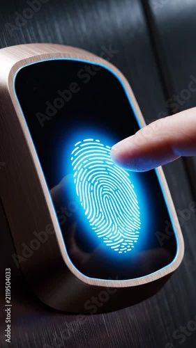 Close-up of a human finger pressing a biometric fingerprint scanner for secure digital access and identification