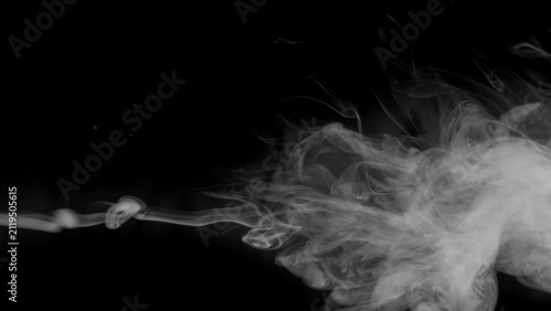 A controlled stream of white smoke drifts horizontally, forming subtle waves and loops that demonstrate the dynamic and ever-changing nature of gaseous substances.