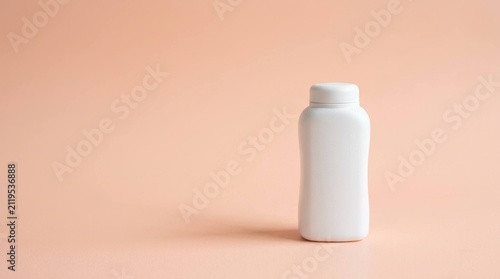 Blank White Cosmetic Powder Bottle Isolated on a Soft Pastel Peach Background

Keywords: