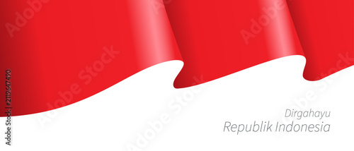 Indonesia flag with a waving red and white design celebrates the national independence day with elegant movement and clear copy space.