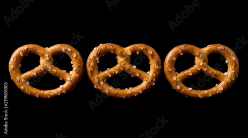 Row of three salted pretzels