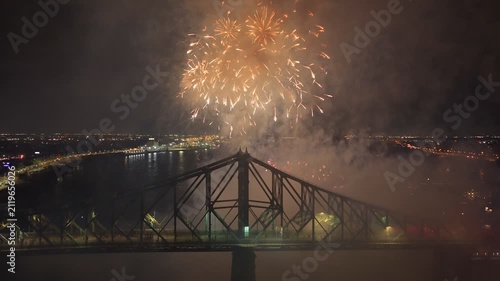 Montreal fireworks over Jacques Cartier Bridge and La Ronde amusement park at night, Quebec, Canada. g.