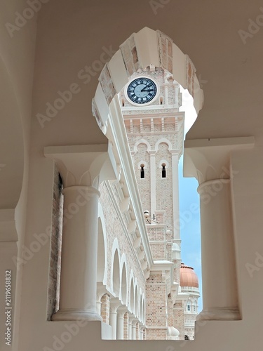 Photography Framed View of Historic Colonial Clock Tower Through Elegant Archway