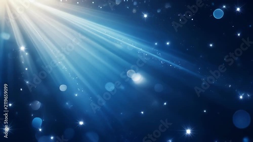 Abstract blue background with bright white light rays and bokeh effects