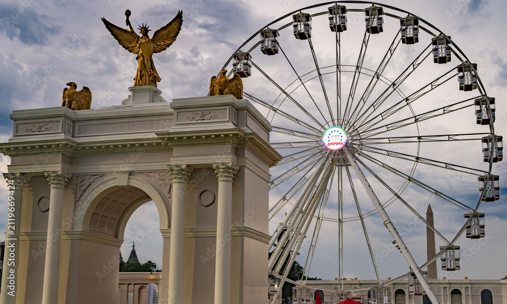 Fototapeta premium Patriotic arch with golden eagles. Historic patriotic arch frames Capitol. Ceremonial patriotic arch honors America. Patriotic arch marks 250th anniversary.