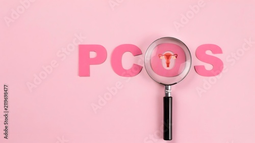 Polycystic ovary syndrome pcos concept with magnifying glass over the letter o on a pink background