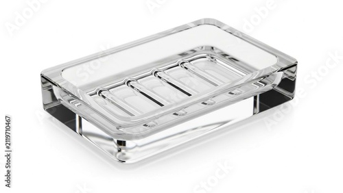 Clear glass soap dish with ribbed base on white transparent