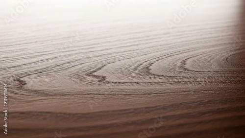 Dark brown wooden surface with natural grain pattern