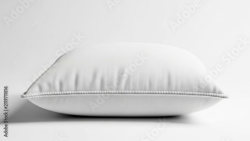Soft white bed pillow isolated on a plain white background