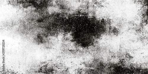 Quadro su tela Grayscale abstract texture with dark splotches and light speckled pattern resembling concrete or distressed paper