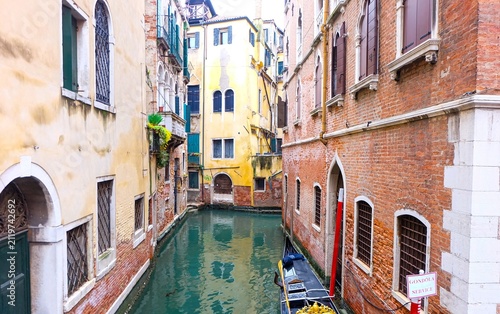 Obraz na plátne City of Venice, canal, bridge, gondola boats, alley and colorful local buildings