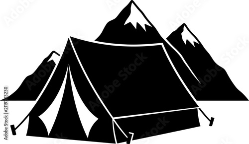 Outdoor camping tent set up in front of high snow capped mountains