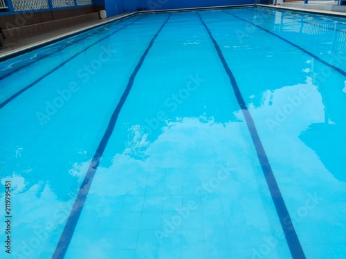 Bild auf Leinwand Clean outdoor lap swimming pool with bright blue water and lane lines