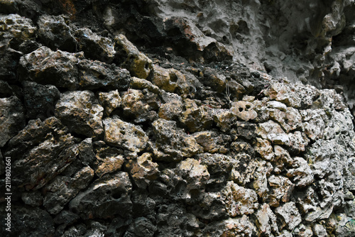Canvas Print Porous limestone rock texture with dramatic light and shadow