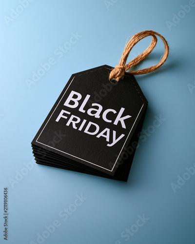Black Friday sale label formed from folded paper tags showcasing abstract retail promotion and elegant commercial concept