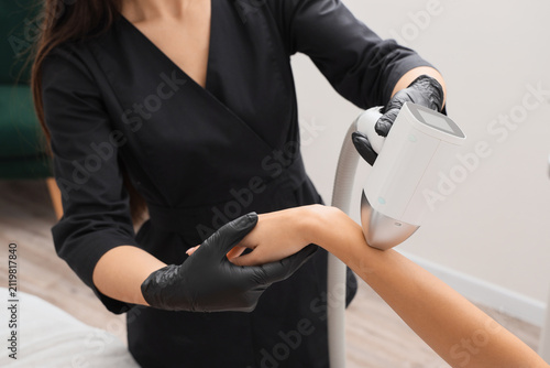 Female cosmetologist perfor...