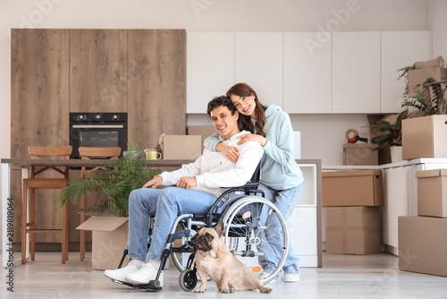 Young man in wheelchair wit...