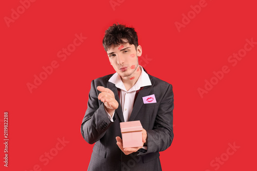 Handsome young man with gif...