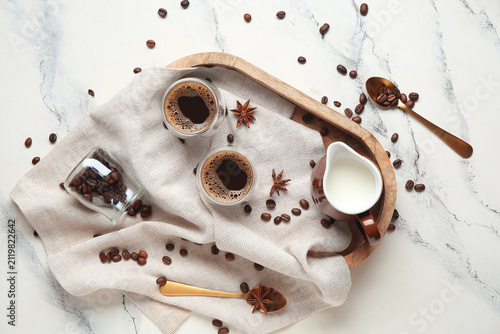 Glasses of hot coffee with ...