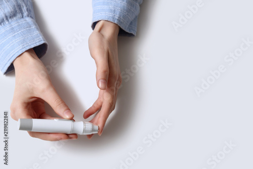 Young diabetic woman using ...