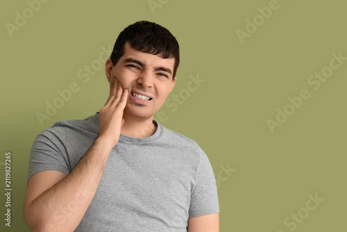 Young man suffering from to...