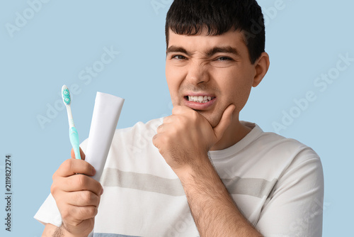 Young man with brush and pa...
