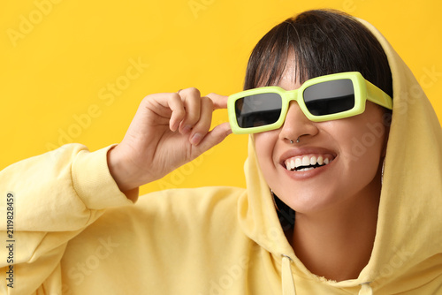 Happy stylish young woman i...