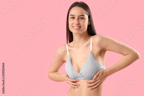 Slim young woman in grey co...