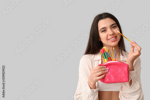 Beautiful young woman with ...