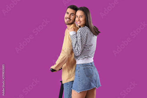 Young couple riding electri...