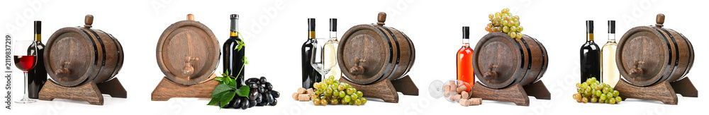 Obraz premium Wooden wine barrels with bottles and grapes on white background