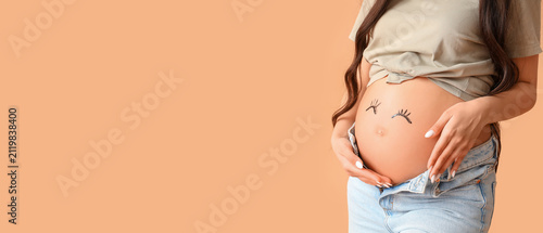 Pregnant woman's belly with...