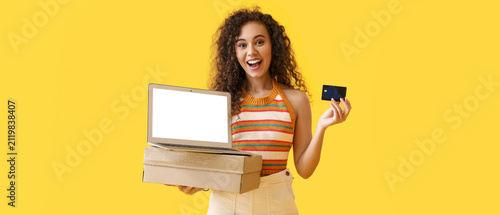 Excited young woman holding...
