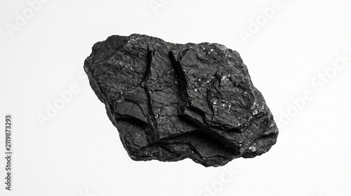 Foto Single piece of black coal mineral isolated on white background
