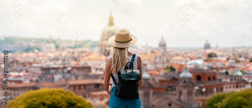 Young Female Tourist with Backpack and Smartphone Enjoying Panoramic View of Rome