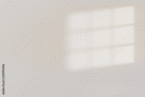 A three-pane window shadow template with blurred shapes on an empty white wall with copy space. Bright sunlight with a sharp shadow overlay effect. Minimalist interior background mockup, 3D rendering.