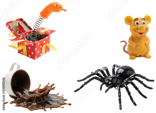Canvastavla A playful collection of prank props and joke toys including a fake spilled coffee cup, toy spider, prank box, and squeaky mouse