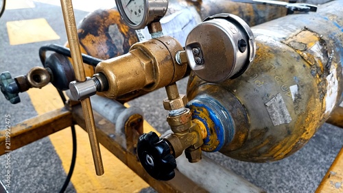 Aircraft tire nitrogen servicing equipment featuring high-pressure nitrogen cylinders and precision pressure regulator mounted on a ground support cart during aviation maintenance