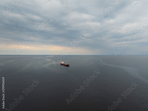 Obraz na plátně Cargo ship sailing in Gulf of Finland Baltic Sea near Estonia coast aerial view